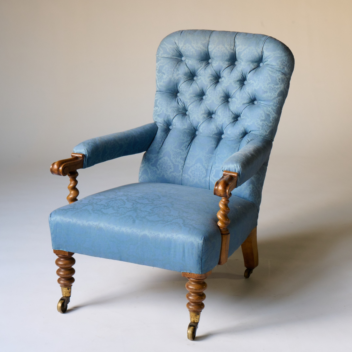 A Victorian Walnut Tufted Spiral Armchair